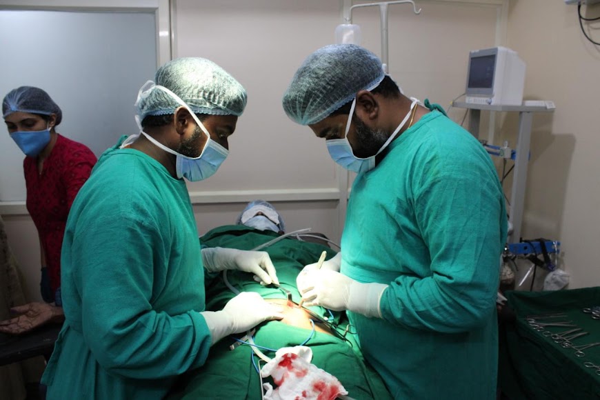 Surgeons performing a procedure in the operating room